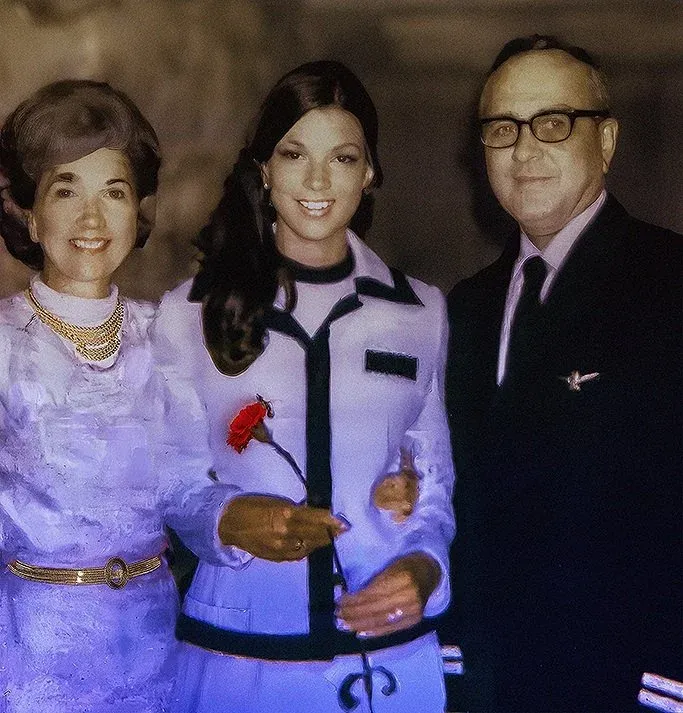 Robyn Stewart in uniform at her 1971 American Airlines Stewardess College graduation, standing between her parents Jay and Marie Ricks